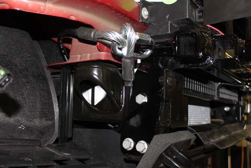 Loosely install a 1/2-13 x 3-1/4 bolt into the hole with a 1/2 lock nut. Do this on both sides of the vehicle.