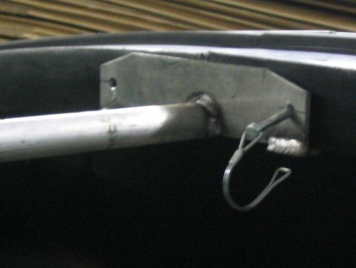 (see the inset picture of Figure 19) You will want to hammer the head of the bolt into the hood so it sucks into the plastic easier. Repeat for other side.