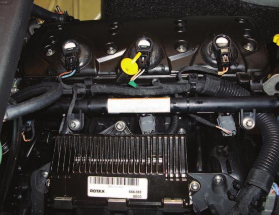 FIG.A 1 Remove the seat to access the watercraft s engine compartment; and remove the cover from the top of the engine.