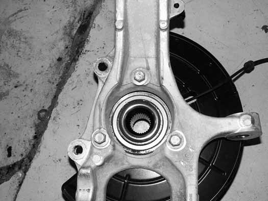 Figure 7 18. Install the hub and dust shield in the corresponding new steering knuckle. Fasten the hub to the knuckle with the factory bolts.