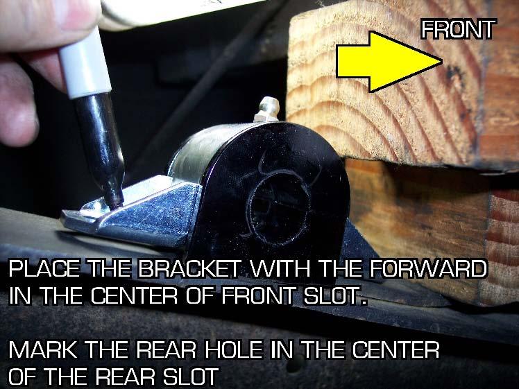 You will need to use the bushing bracket as a template to locate the rearward hole. Place the bracket over the rivet hole and mark the frame for the second hole.