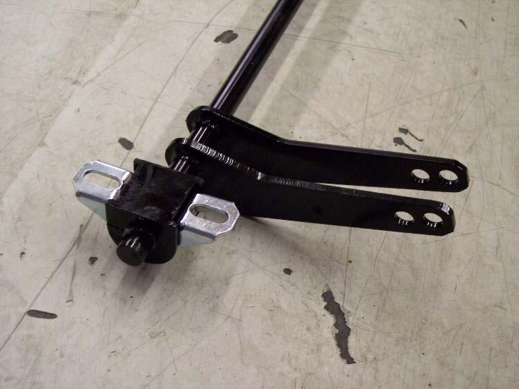 Next, install the bushing brackets onto the bushings. Position the sway bar onto the truck as shown.