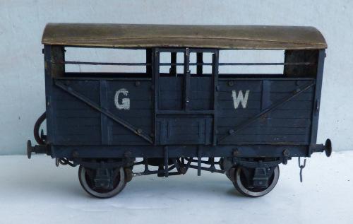 . Price ( ): 7.50 1.375 Unidentified (possibly including L.MC components) 2-axle wooden-bodied 7- plank Open Wagon, dark brown, carrying small white lettering 'L.M.S.' and diagional white stripe.