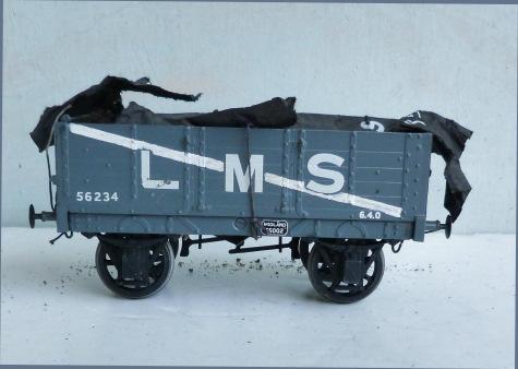 1.392 Unidentified (possibly Cooper Craft) kit-built 2-axle 5-plank Open Wagon, midgrey, lettered 'L.M.S. 56234', with diagonal white stripe. Fitted with sheeted load covered by imitation L.M.S. tarpaulin sheet.