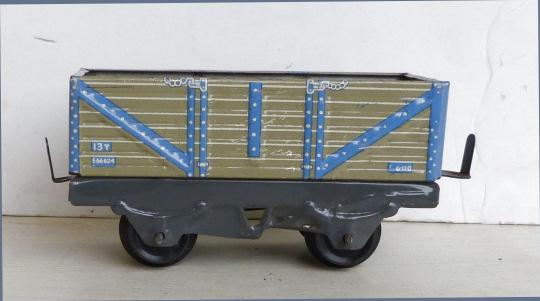 Mettoy 2-axle 7-plank open Wagon, light grey with blue ribbing. on dark grey underframe.