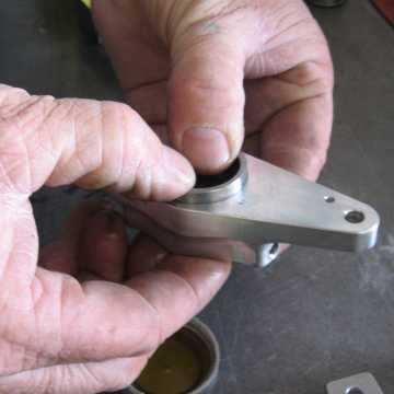 the piston gently into the caliper with the cupped side of the piston facing outwards.