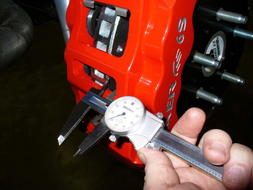 Shimming Procedure: Measuring caliper clearance for centering Measure the gap from the rotor to caliper body at 4 points, top inside and outside, bottom inside and outside.