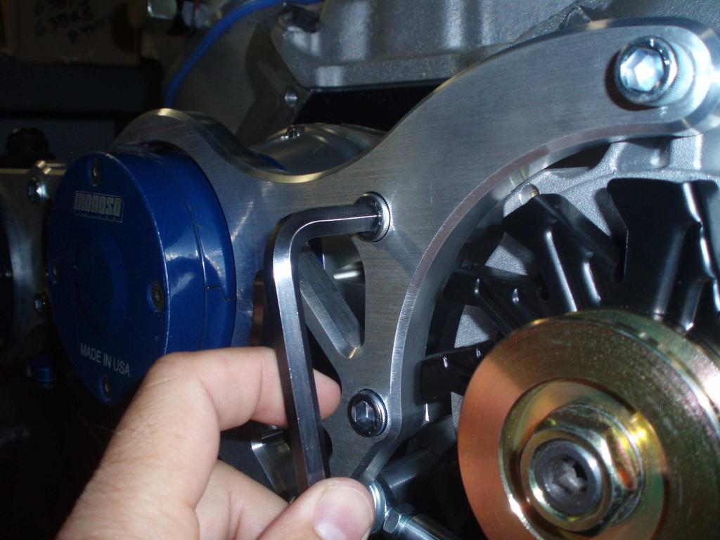 PLACE A 3/8 FLAT WASHER AND LOCK NUT ONTO THE ALTERNATOR BOLT AND LEAVE HAND-TIGHT.