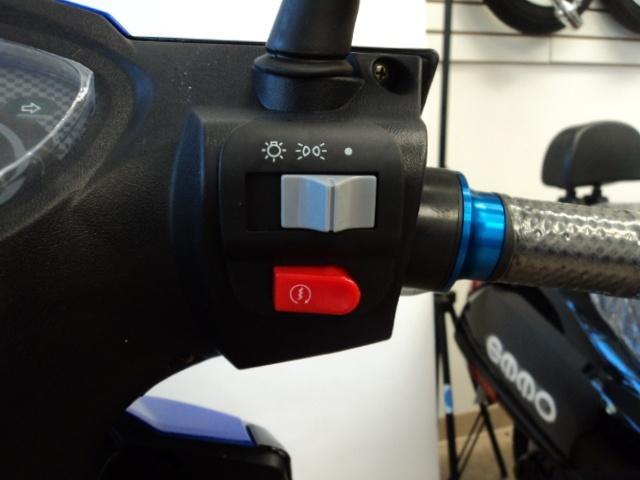 When the switch is pushed to the left, the head-lights, taillights, and dashboard light are turned on When the throttle is turned backwards (toward the rider) it makes the e-bike move forward.