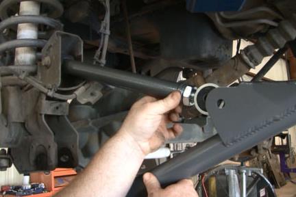 Install upper control arm into pocket on axle using stock hardware then attach it to lower control arm using supplied 9/16 x 3.75 bolts. See Photo 9.