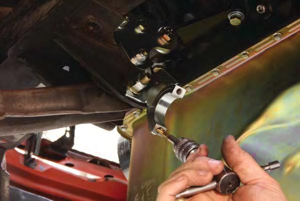 20. Bolt the lower rack brackets to the lower control arm mounts using the orientation and hardware shown on