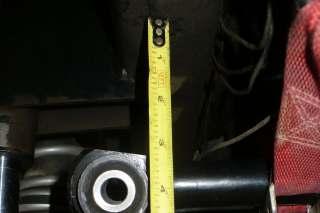 Bump stop measurement shown from bottom of frame to mounting hole with stock Track Bar.