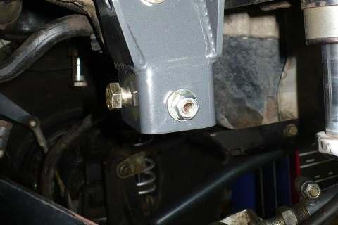 Note, lower bolt must be installed with nut on outside of brkt to clear TB.