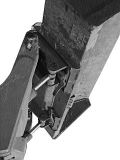 To operate, simply lift the two over - centre locking levers to disengage the lock pins (Fig. 2. 11B). Tilt the quick-tach frame forward (Fig. 2. 11A) with the bucket tilt cylinders and drive into the attachment.