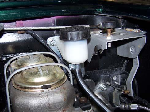 FLUID RESERVOIR MOUNTING 1. Remove the studs or nuts on the left hand (driver) side of the brake master cylinder. 2.