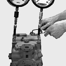 screw, rotate clockwise until the pressure increases in one of the pressure gauges. Note the angular position of the wrench.