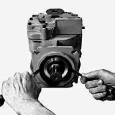 Position the pump with the shaft facing up. Note: If the unit is positioned horizontally when the shaft is removed, the cylinder block could move out of place, making shaft installation difficult.