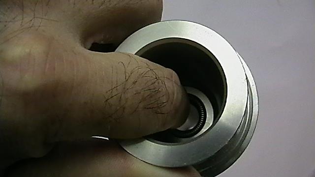 With a finger start one side of the seal into the seal groove & carefully work around the seal until it pops into the groove. See Fig 27. Figure 27 9.