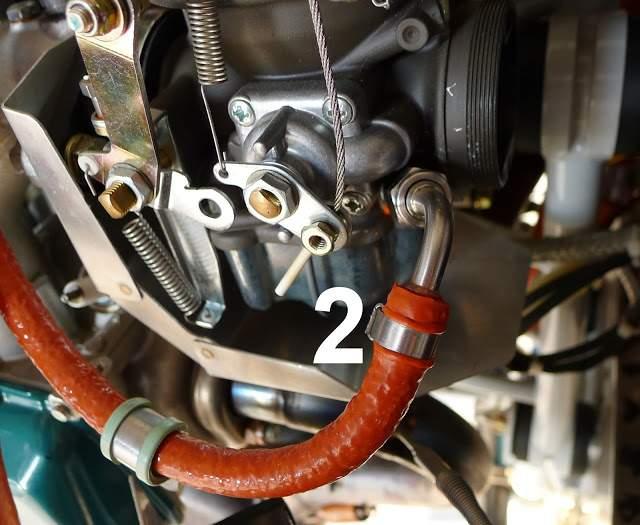 Step 12: Install Hose 2 (the lengthier of hoses 2 and 3) onto the left side carburetor.