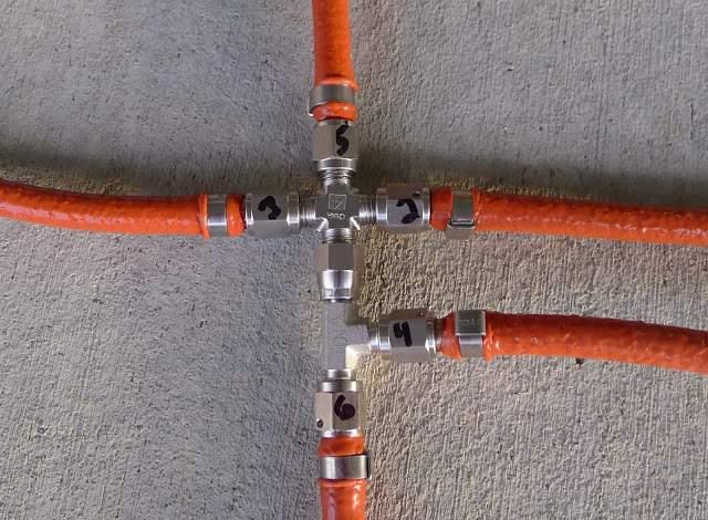 Here are two pictures of the fuel lines in the proper orientation in relation to the stainless