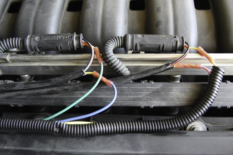 6. Use one of the supplied butt connectors to connect the green SAP Simulator wire to the yellow wire that leads towards the oxygen sensor plug & engine harness. 7.