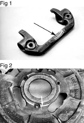 Clutch Cover / Intermediate Plate Clutch Cover/Intermediate Plate Failures Failure - Yoke Bridge Rubbing into Cover The arrows in Figures 1 and 2 show the areas of contact between the release yoke