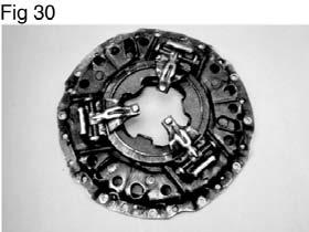 Clutch Cover / Intermediate Plate Failure - Oil Soaked Cover A leaking transmission or a leaky rear main engine seal can coat the clutch cover with oil, as indicated in Figure 30.
