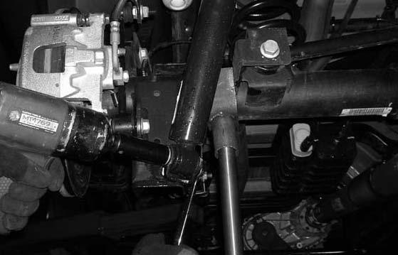 Locate the stock front end link mounting hardware. Working on the driver side, install the stock front sway bar end link into the stock lower mounting location and secure using the stock hardware.