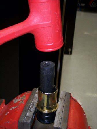 - Grab a large deep socket and use it as a punch to hammer the rest of the bushing out. 11.