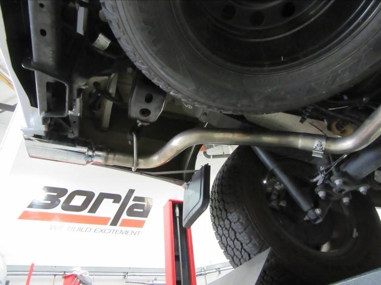 Place a clamp over the expanded end of the L/H tail pipe assembly and insert inlet on to the crossover pipe assembly.