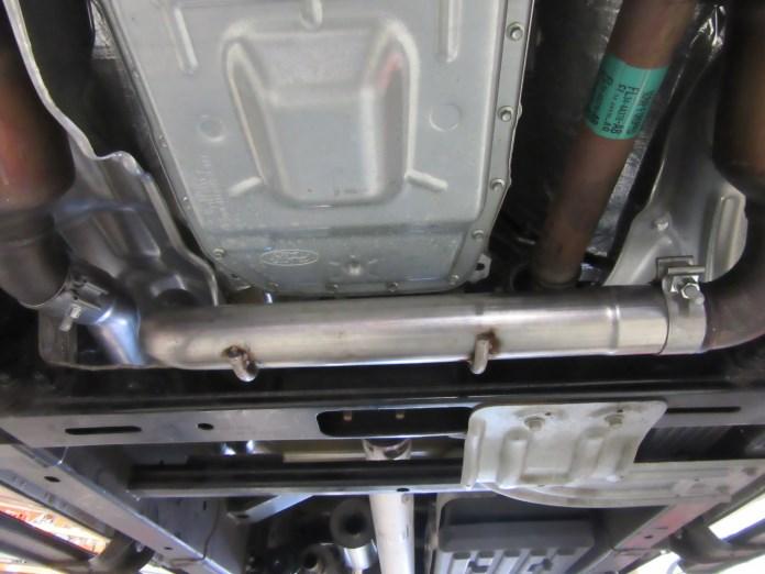 Place clamps over the expanded ends of the X-pipe Assembly and insert the inlet to the L/H and R/H Front Pipe Assemblies. (See Fig. 10) Do not tighten the clamps. 5.