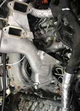 Remove the serpentine belt, unbolt the AC compressor and move it out of the way.
