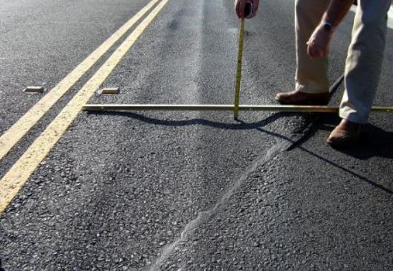 distraction, alcohol, stress, physical deficiency and age, are combined with pavement distresses. Figure 1.2. Example of pavement rutting (http://www.qespavements.