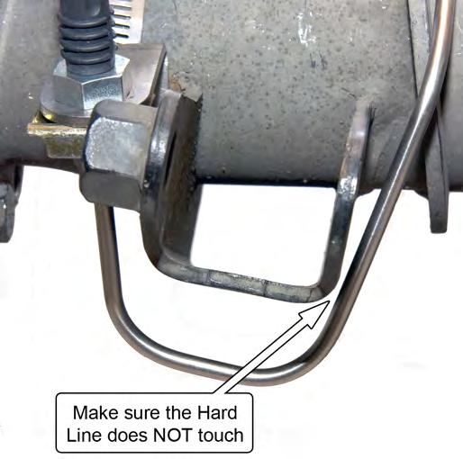 movement. 23. Tighten the Axle Vent fitting while holding the Brake Hard Line Mounting Bracket. 24.