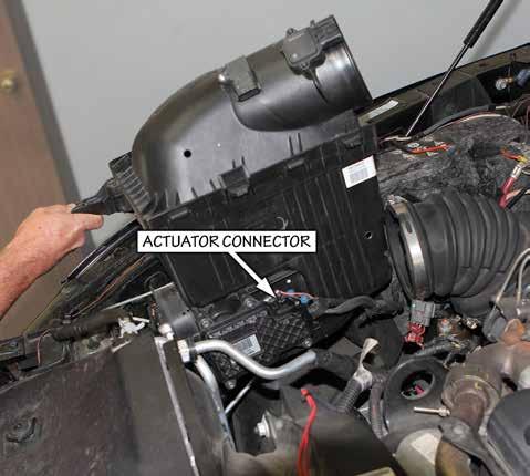 Temperature (IAT) sensor connector and remove the connector. Pull the plastic anchor holding the wiring harness to the air housing lid and move the harness out of the way. 4.