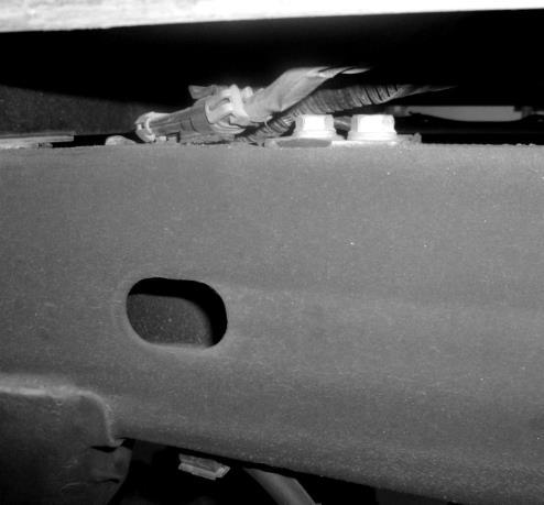 7 8 9 3c) Remove the clips that hold the brake lines and wire loom in front of the bed rail on the driver s side (Photo 8).