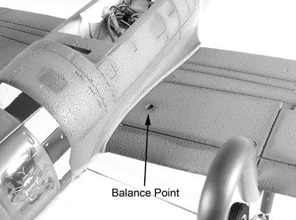 2. Turn the model over and place your fingertips in the recess in the wing. The model will rest level when balanced.