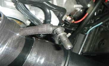 Insert the supplied 45 degree breather hose adapter into the supplied throttle body hump hose.