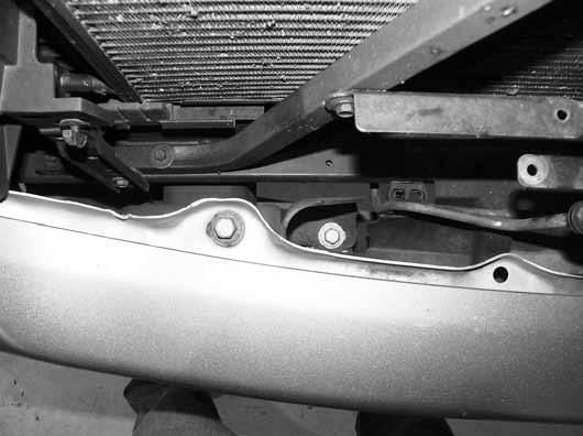 Figure 8 13. Since the grill was removed, the four inside bumper bolts (two on each side) can be accessed from above the bumper Figure 9.