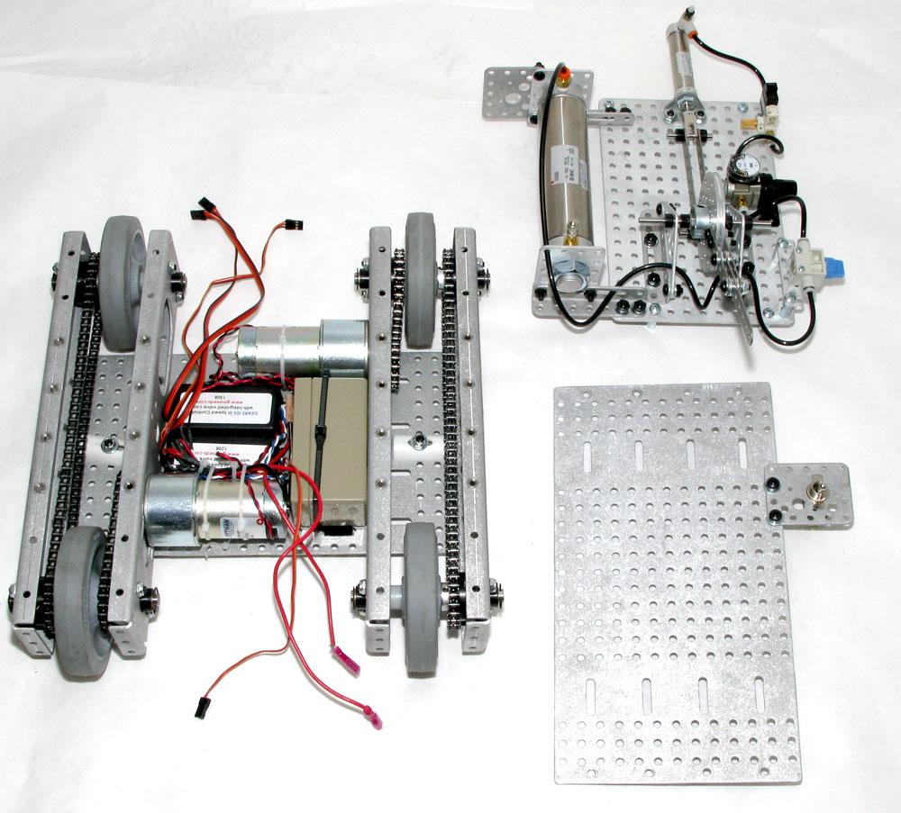 The image below illustrates the completed chassis, the chassis top plate and the pneumatic module prepared for integration.