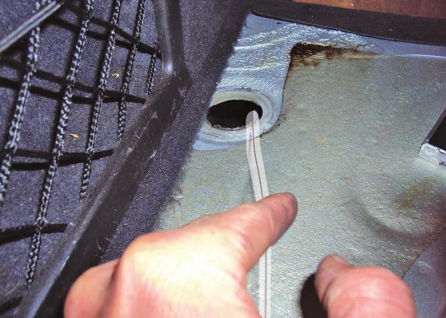 Remove the soft plugs and the air line access hole drilled in step 10 can be seen within the chassis channel (fig. 24).