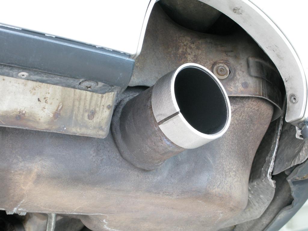7. For Tail Pipes only: slide the reduction rings onto both stock muffler outlets (Figure