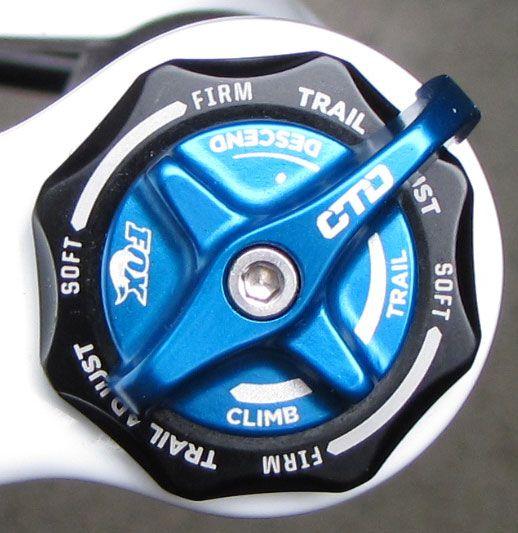Rotate the blue CTD lever fully counter-clockwise to set the fork to Descend mode. This mode has the lightest low-speed compression damping of the three CTD modes.