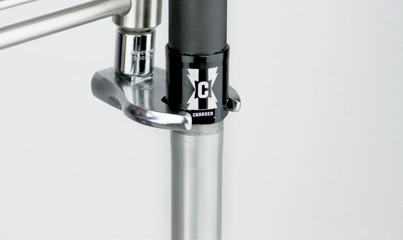 Place a 21 mm open end wrench on the wrench flats on the damper cartridge tube. While holding the damper cartridge tube in place, tighten the coupler to 9-10 N m (80-90 in-lb).