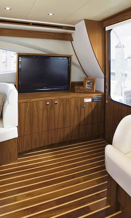 The Grain-Filled Teak interior of the 4800 Convertible is large and comfortable, featuring a greatroom with salon, entertainment center, dinette/settee and galley, and 3 private staterooms and 2