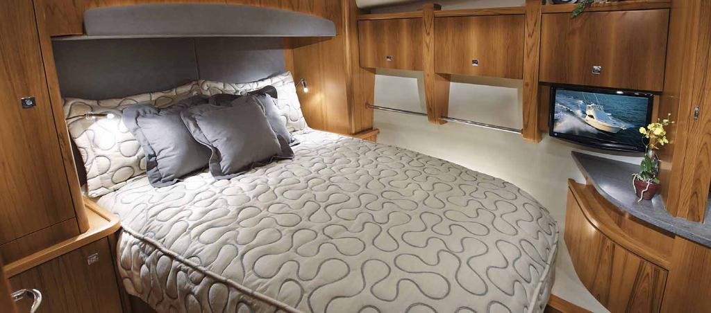 The lower level of the 4800 Convertible features 3 staterooms and 2 heads Mid-ship is the portside MASTER STATEROOM, with full frame entry door, queen pedestal berth (storage under) with deep quilted