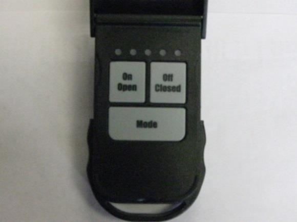 Push and hold the slotted button and the large Open button (See Figure 6.1) simultaneously and hold for approximately 10 seconds.