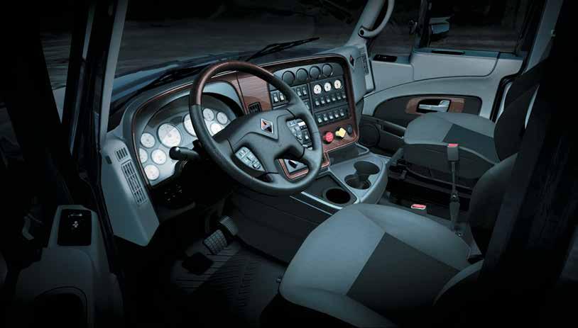 harsh vocational environments Available ivory or black faced gauges with chrome bezel and rosewood dash fascia Ergonomic center panel with easy-to-reach switches and vehicle control Strong, quiet cab