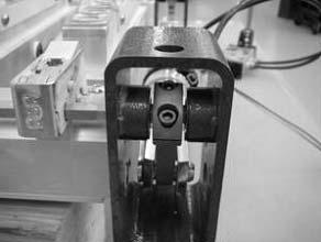 Remove the clamp screws (5) from each lever (4), then remove the cylinder and lever assembly from the hex bars ().