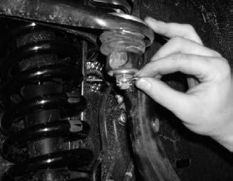 Remove the hydraulic floor jack from under the driver side stock lower control arm. 23. Locate the stock upper control arm castle nut.